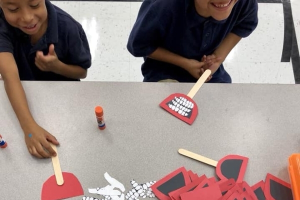 Students building their smiles with an arts and crafts activity. 